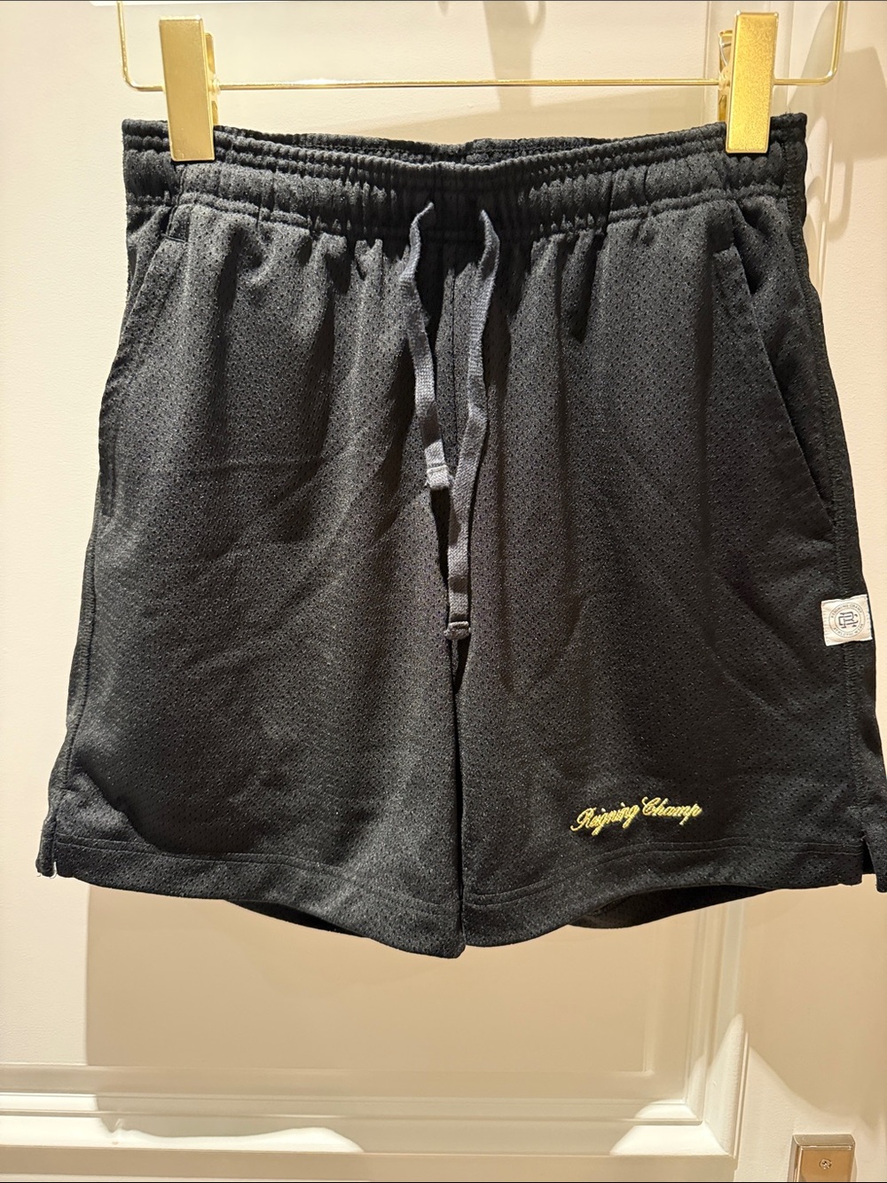 Reigning Champ Black Athletic Mesh Shorts with Yellow Script